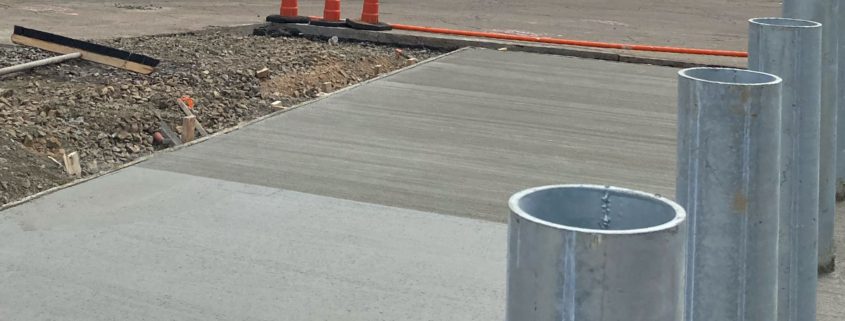 New concrete foundation with orange cones