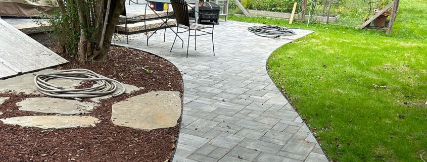 Paved stone path in residential backyard