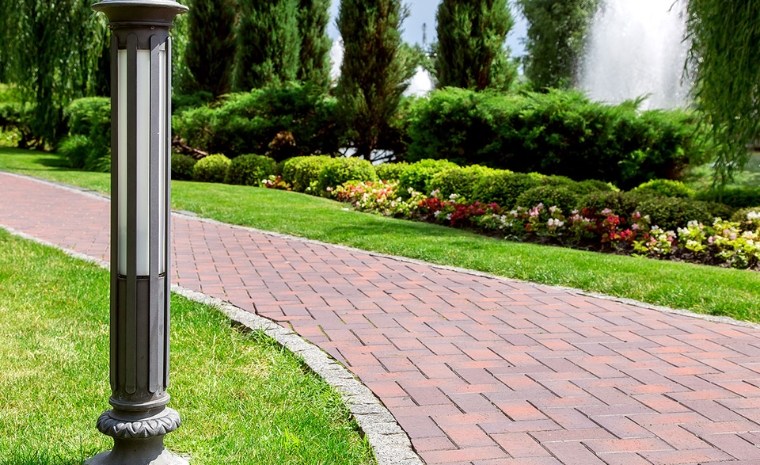 A paver walkway in Old Saybrook, CT, featuring a decorative fountain at its center, enhancing curb appeal.