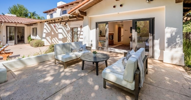 A well-furnished patio with a patio door, representing an inviting outdoor area for Connecticut residences.