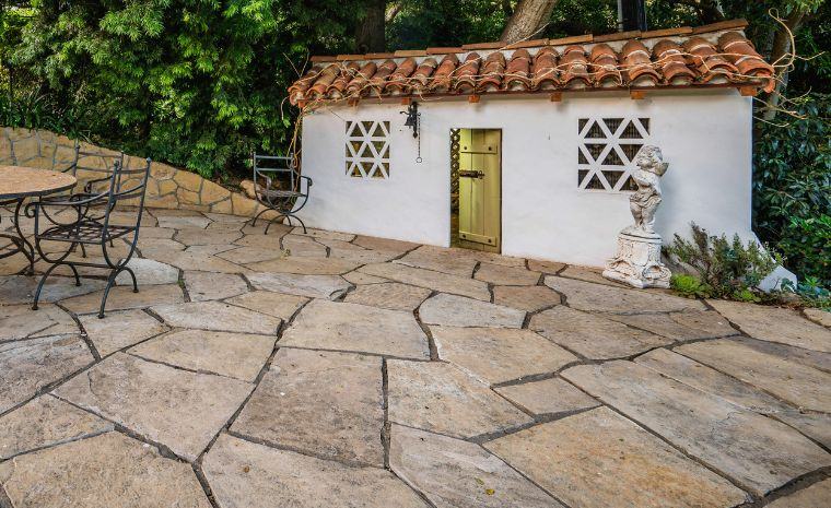 Flagstone patio with natural stone texture and color matching for a seamless outdoor living space