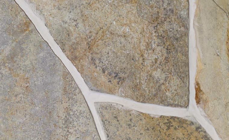 Close-up of flagstone joints with clean mortar lines and precise stone installation