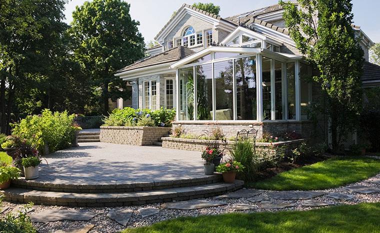 Stone patio build in Greenwich CT with tiered steps and custom outdoor living space