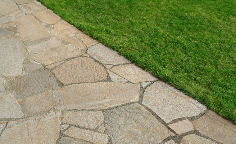 Natural stone patio with quality materials and clean edging in Guilford CT