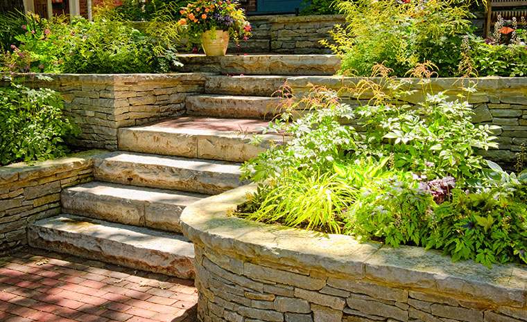 Hardscape contractor in Branford CT constructing stone retaining walls and landscape steps