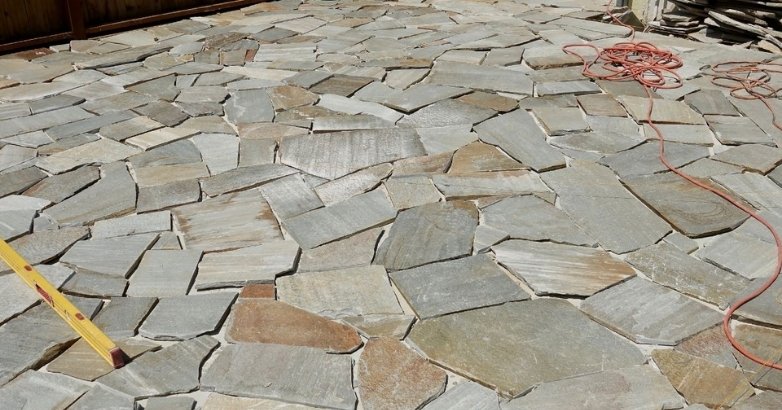 Flagstone patio installation with natural stone design in Connecticut