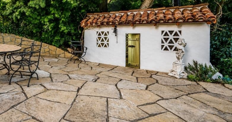 Flagstone patio with large natural stone slabs showcasing long term durability and lifespan