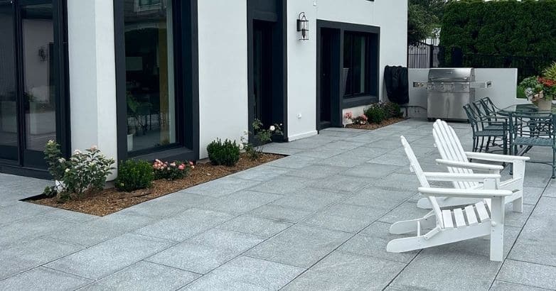 Modern granite patio installation with sleek outdoor living space design